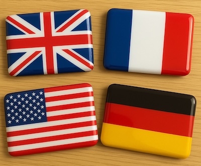 Adhesiu amb bandera nacional en resina brillant sobre fons blanc